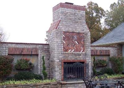 Custom stone brick outdoor fireplace