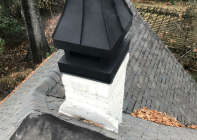 White brick chimney with cover